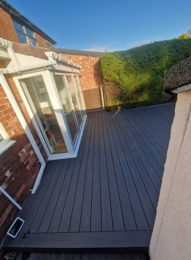 Composite decking laid to a rear garden, Ashburys Property Renovations project near Romiley village, Romiley SK6