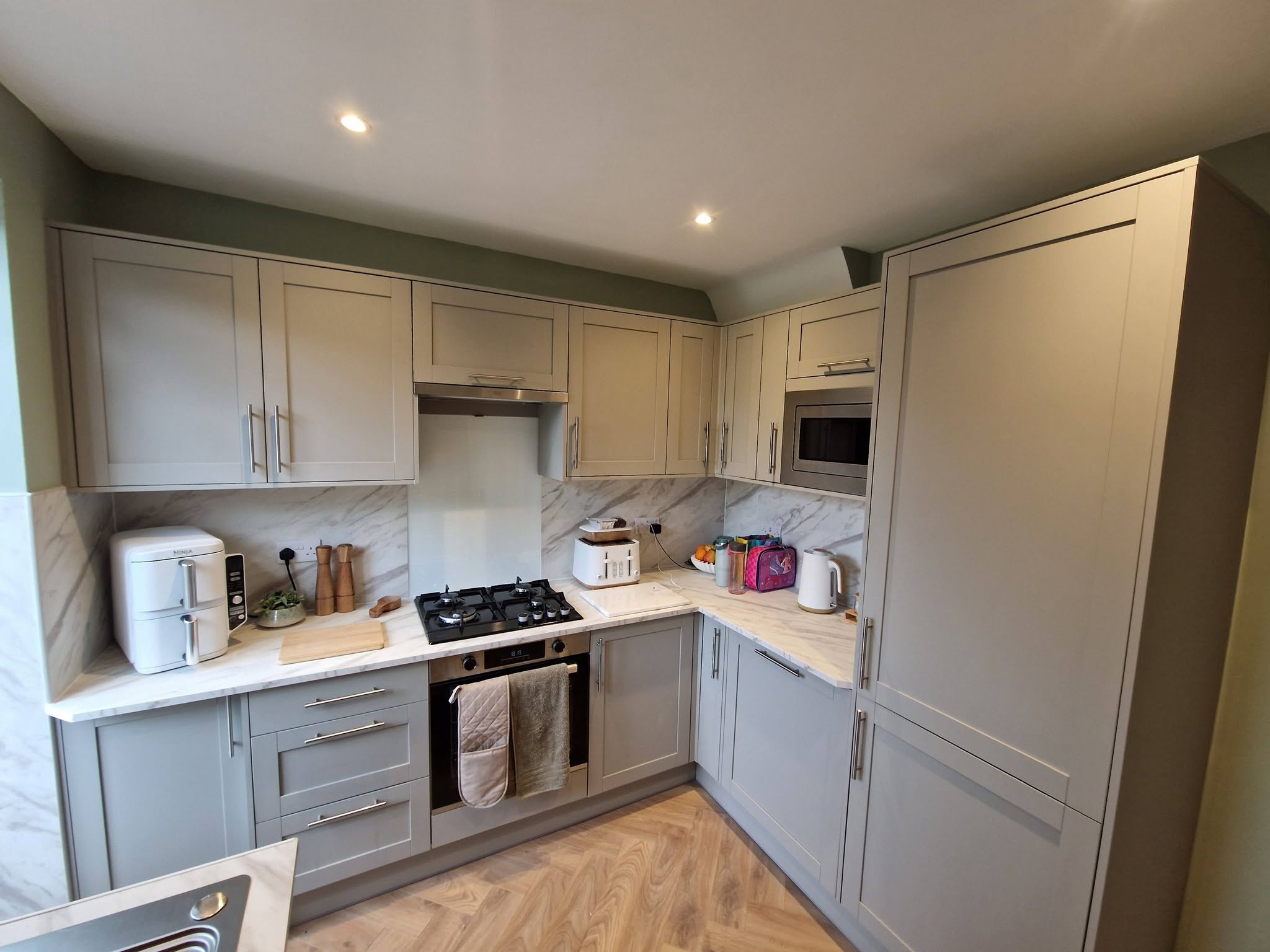 Shaker kitchen with a marble splashback, Ashburys Property Renovations, Stockport